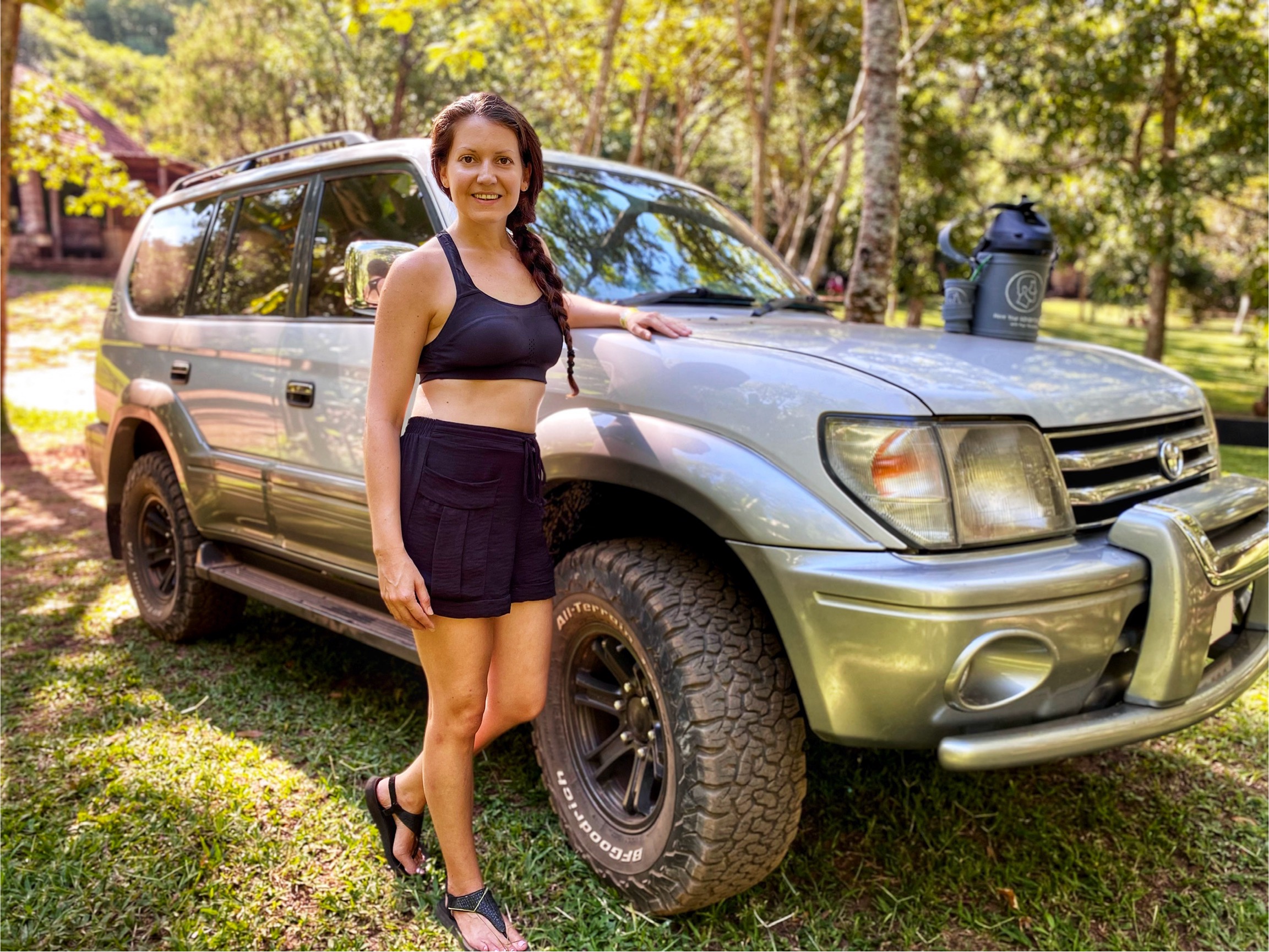 Alexander Allover in front of 4x4 truck