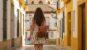 Girls walking in a Portuguese village with a backpack