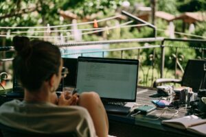 Digital nomad working form a balcony